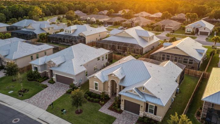 Orlando neighborhood with metal roofs at sunset